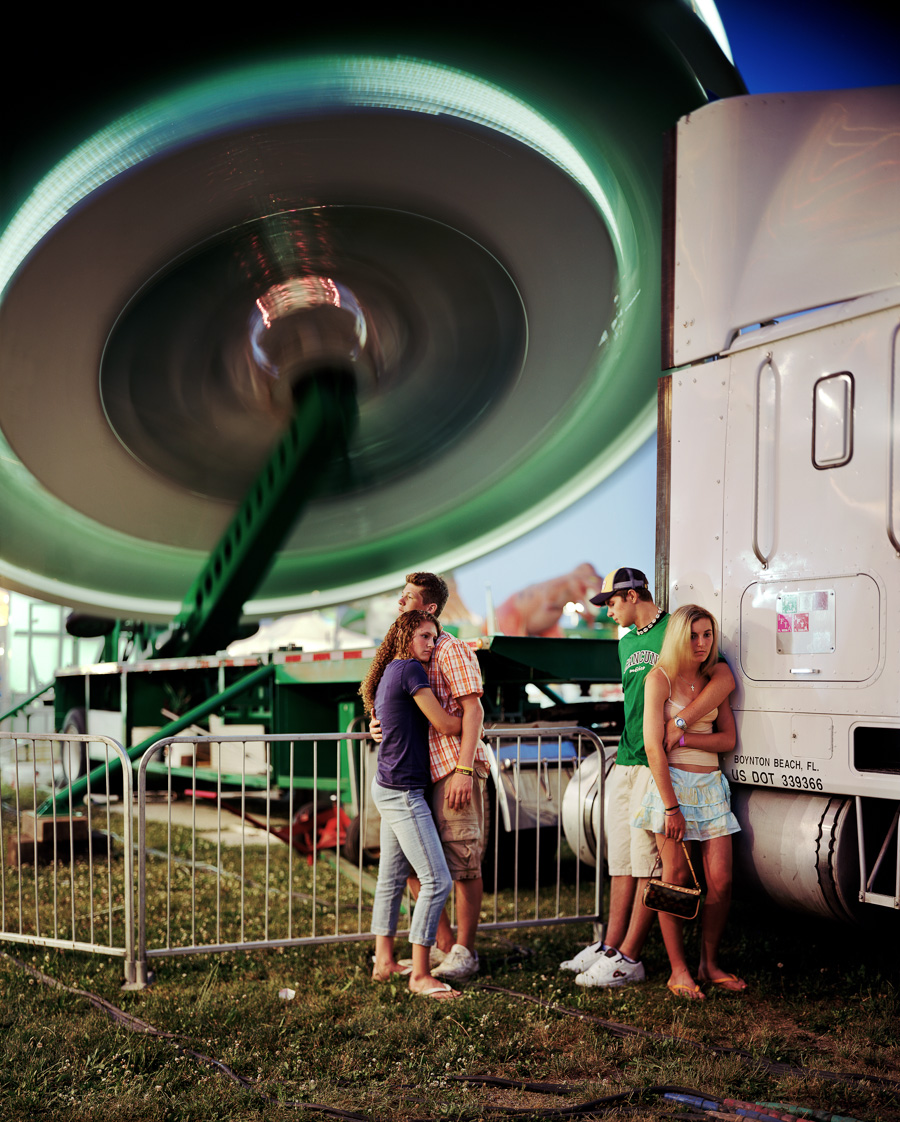 Schnecksville Community Fair, 2005. Photo by Greg Miller using movement in the background and asking his subjects to perform an action in the foreground