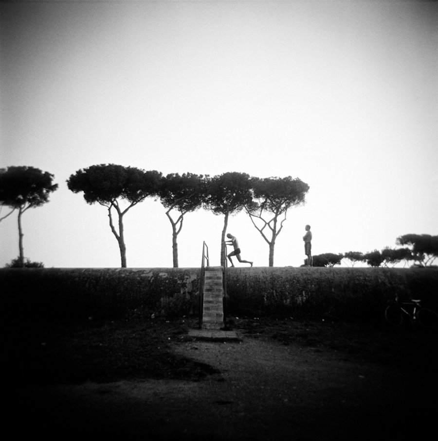 Romans work out at Aqueduct Park in the district of Tuscolano. Rome, September 2013. (Photo by Viviana Peretti, shot with an Holga camera).