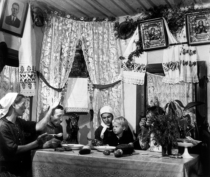 A family meal at a collective farm, Ukraine, USSR, 1947 by Robert Capa (c) Magnum Photos