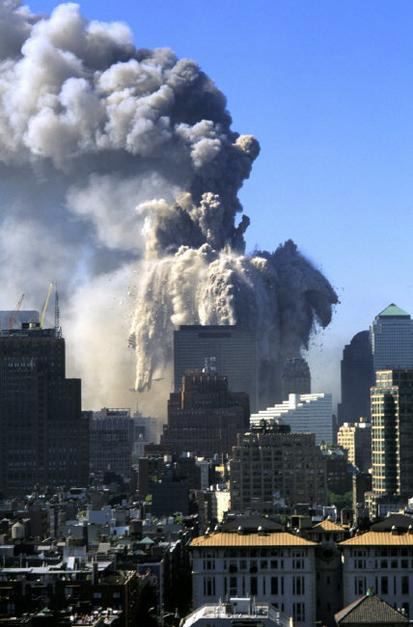 The collapse of WTC seen from a roof at Washington Square Park and Fifth Avenue., New York, USA, 2001 by Steve McCurry (c) Magnum Photos