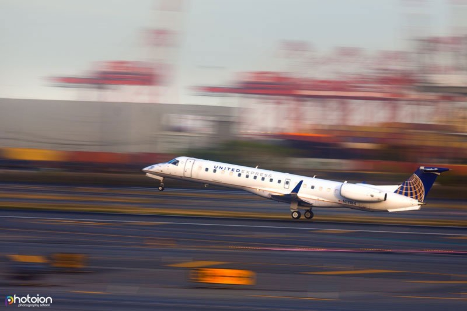 panned photo of a jet taking off