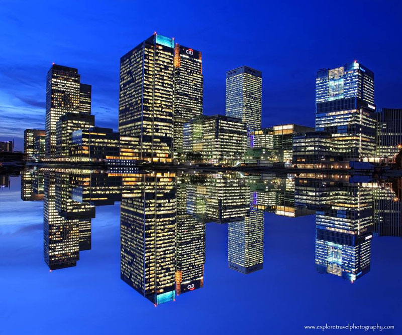 Canary Wharf photographed at night with the River Thames